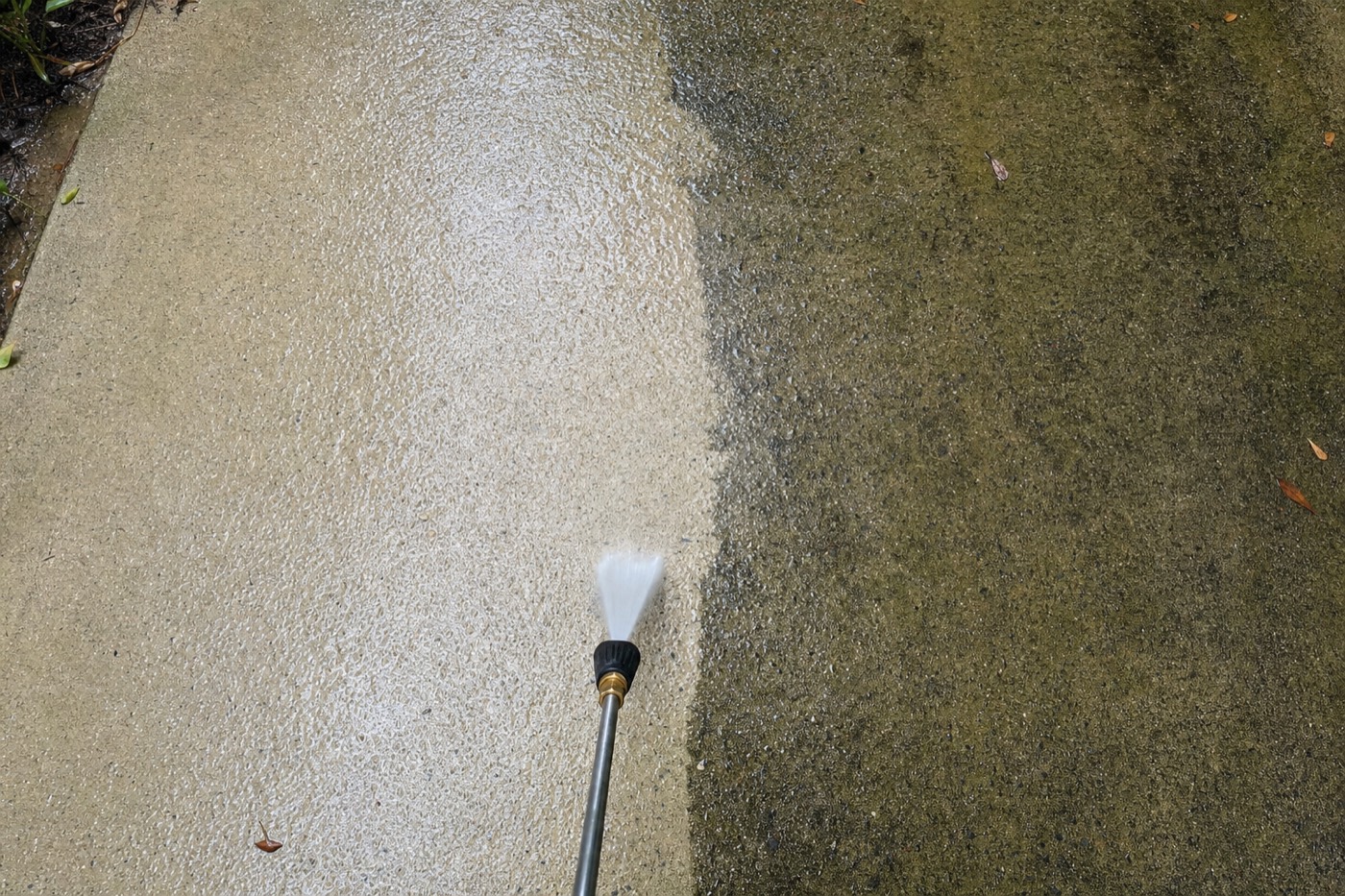 Sample image: driveway shown half pressure-washed and half untouched in a single frame